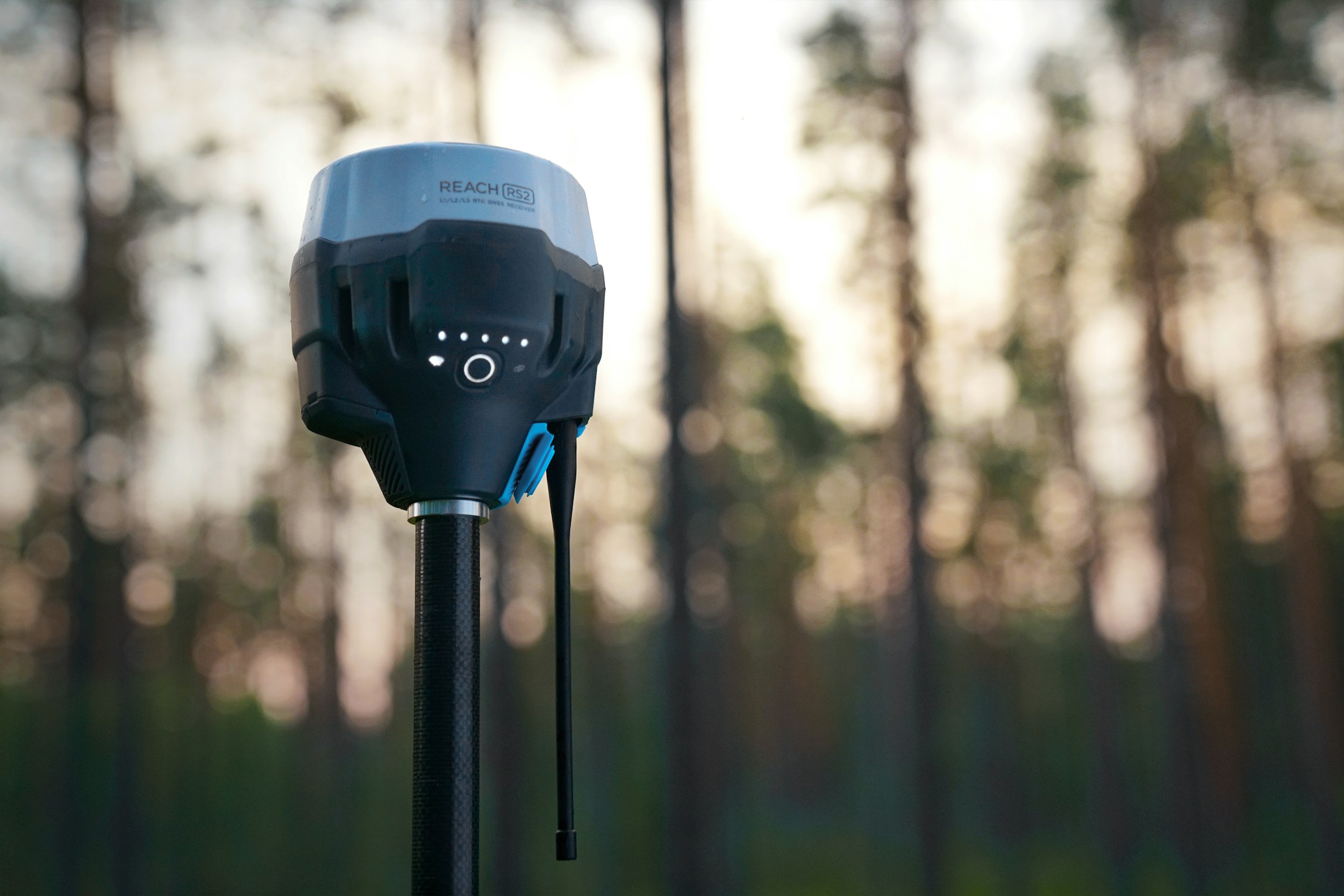 Advanced surveying equipment in a forest setting